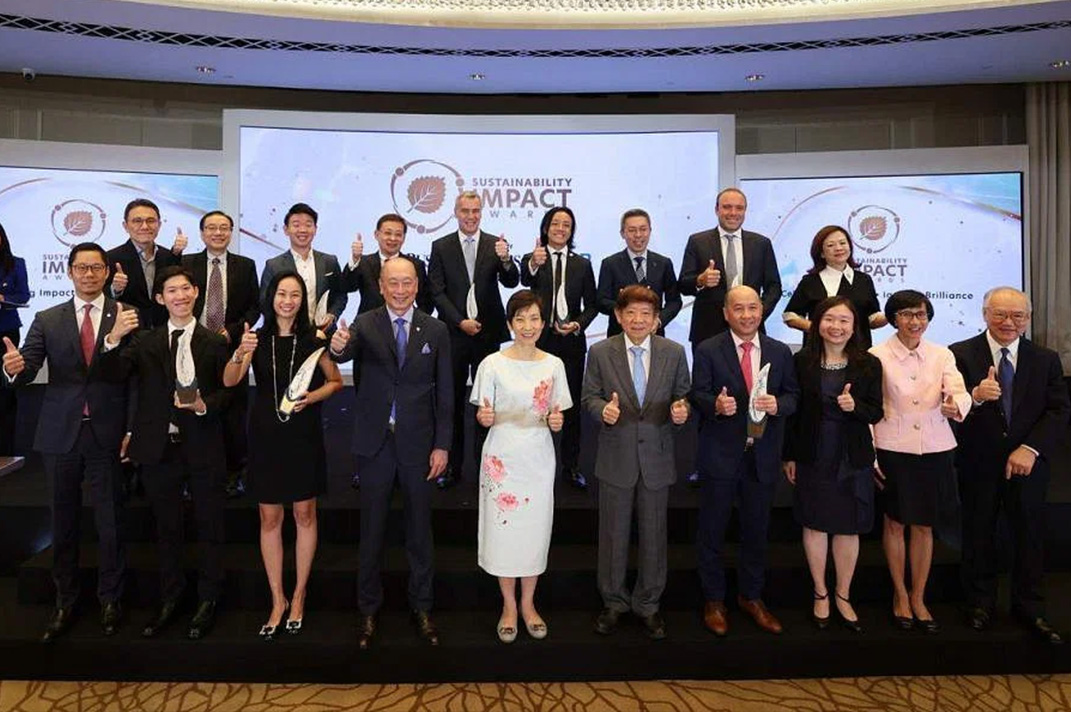 Grace Fu, Minister for Sustainability and the Environment, poses with representatives of the companies recognised for their considerable achievements in making a positive change on the sustainability front in Singapore.