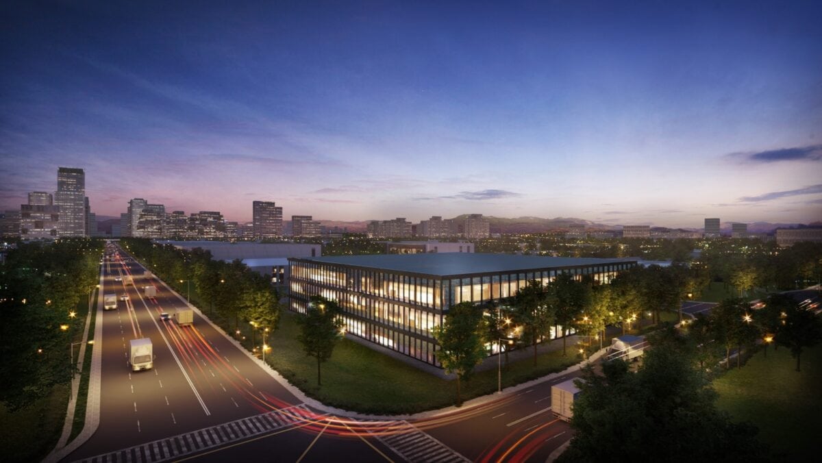 Modern renewable energy facility in an urban setting at dusk.